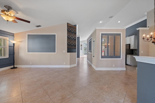 unfurnished living room featuring crown molding, ceiling fan with notable chandelier, and light tile patterned flooring