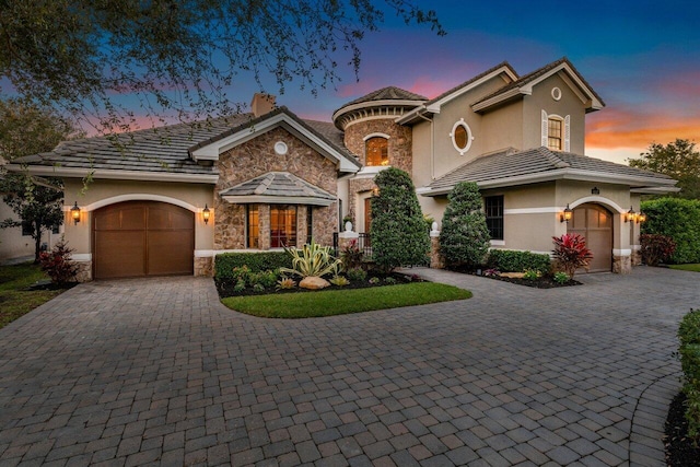 mediterranean / spanish-style home featuring a garage