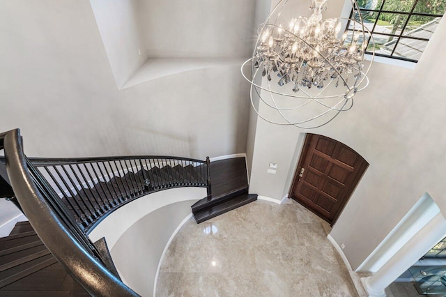 foyer entrance with an inviting chandelier