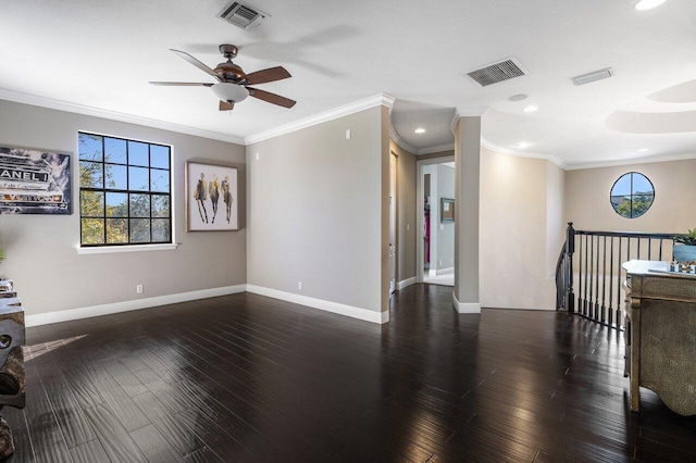 unfurnished living room featuring dark hardwood / wood-style flooring, ornamental molding, and ceiling fan