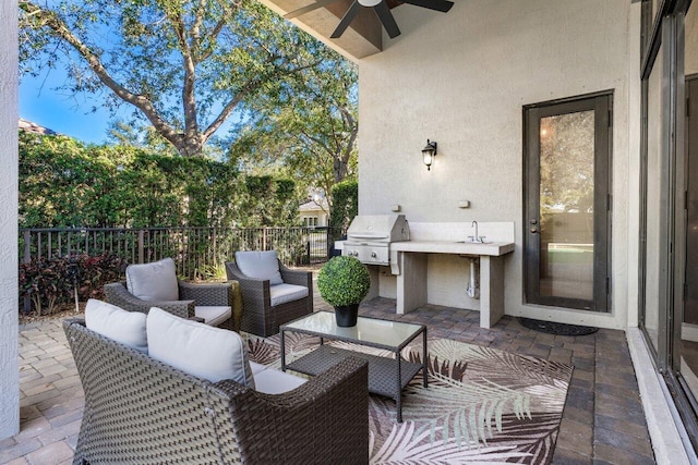 view of patio / terrace featuring an outdoor hangout area, grilling area, and ceiling fan