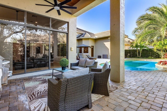 view of patio / terrace featuring ceiling fan, an outdoor hangout area, and a fenced in pool