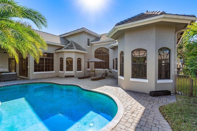 view of swimming pool featuring a patio