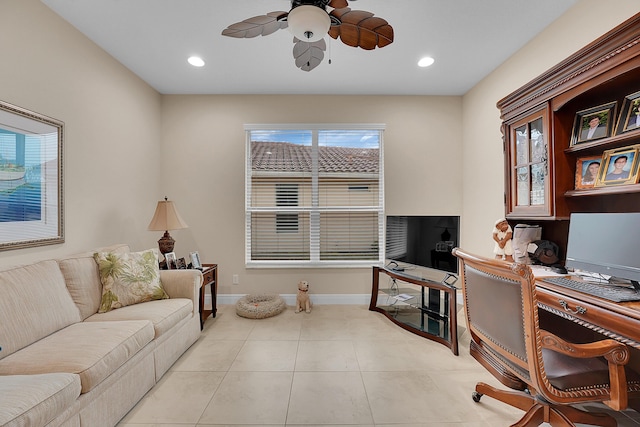 home office with light tile patterned floors and ceiling fan