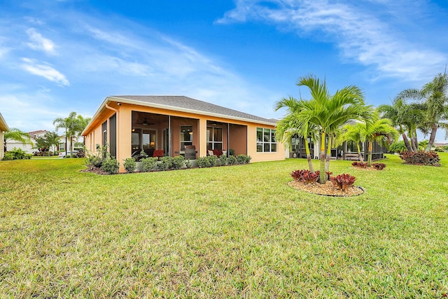 back of property featuring a lawn