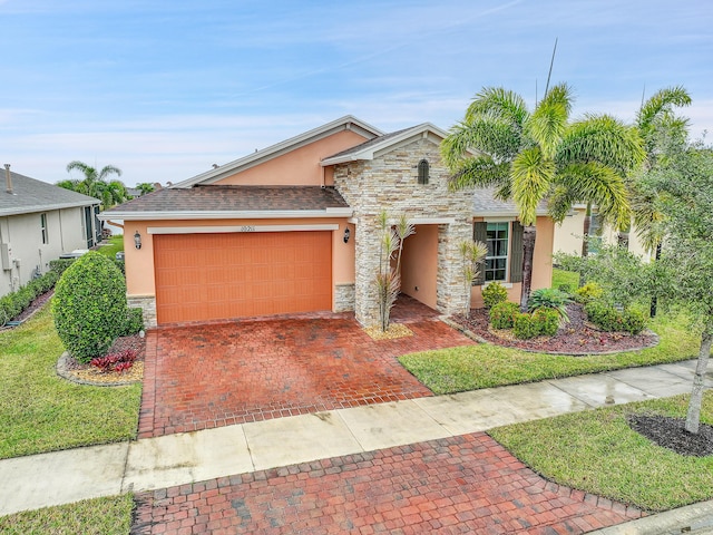 view of front facade featuring a garage and a front lawn