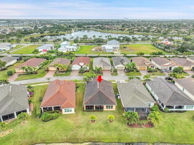 bird's eye view with a water view