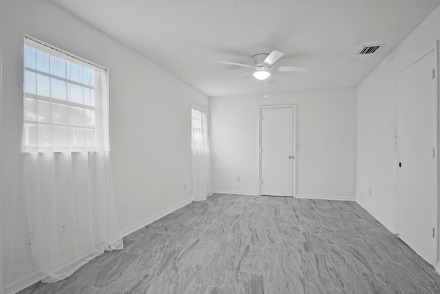 empty room featuring ceiling fan