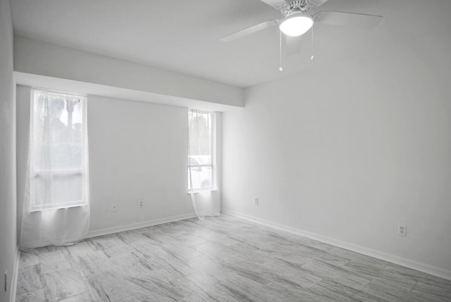 empty room featuring ceiling fan