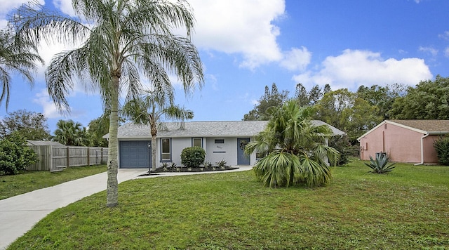 single story home with a garage and a front yard