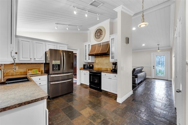 kitchen featuring black appliances, exhaust hood, decorative backsplash, sink, and hanging light fixtures