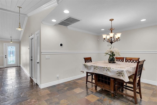 dining area featuring crown molding and an inviting chandelier