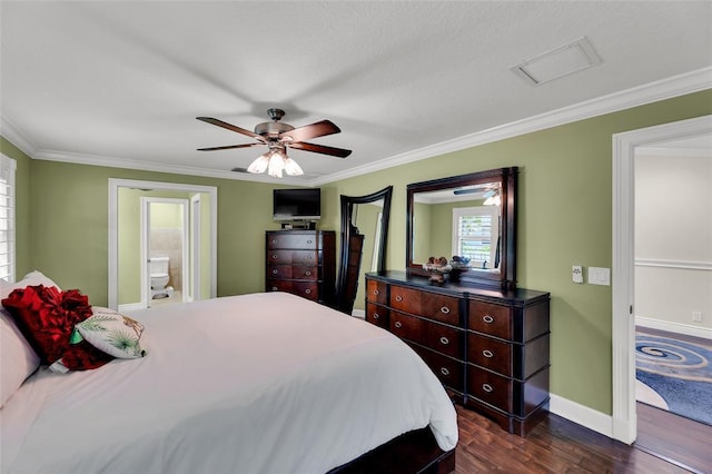 bedroom featuring dark hardwood / wood-style flooring, ensuite bathroom, ceiling fan, and ornamental molding