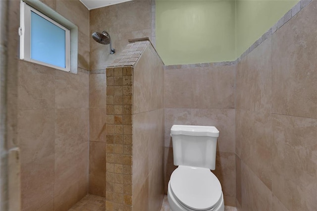 bathroom featuring toilet and tiled shower