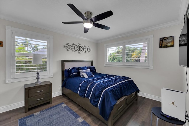 bedroom featuring ceiling fan, multiple windows, dark hardwood / wood-style floors, and ornamental molding