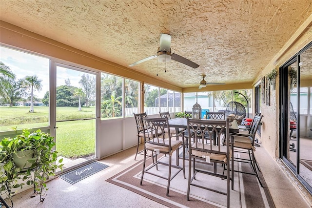 sunroom / solarium with ceiling fan