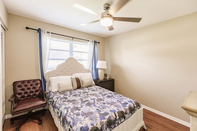 bedroom featuring ceiling fan and hardwood / wood-style flooring