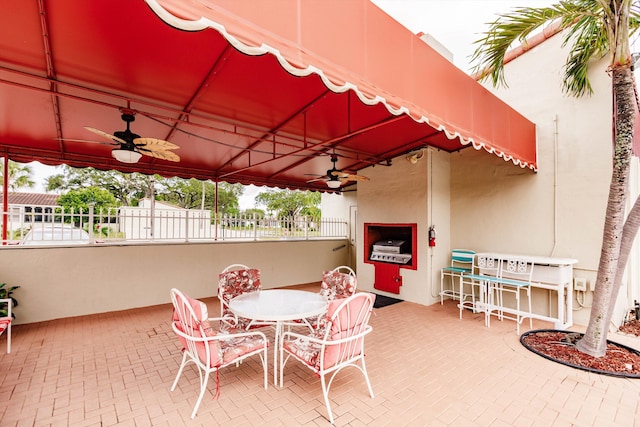 view of patio featuring ceiling fan