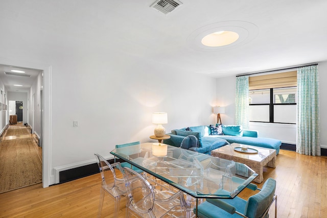 living room with light hardwood / wood-style floors