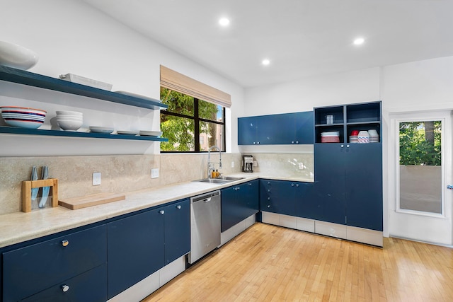 kitchen featuring light hardwood / wood-style floors, dishwasher, decorative backsplash, sink, and blue cabinets