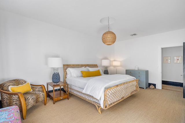 bedroom featuring light carpet