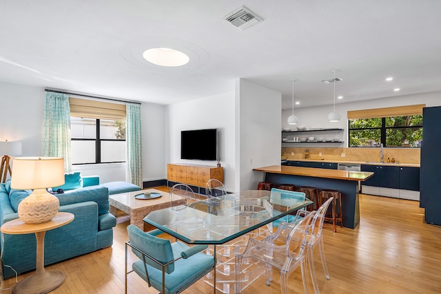 interior space featuring sink and light hardwood / wood-style floors