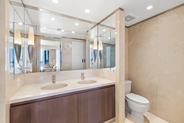 bathroom with toilet and vanity