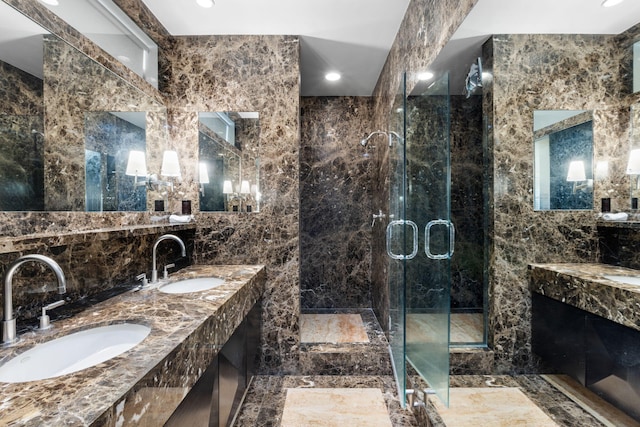 bathroom with vanity, tile walls, and an enclosed shower