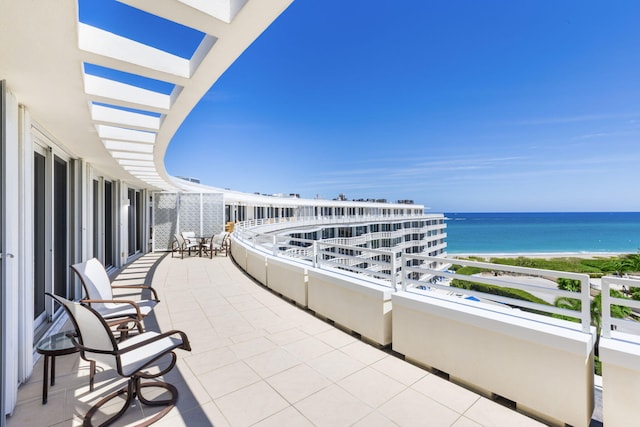 balcony featuring a water view