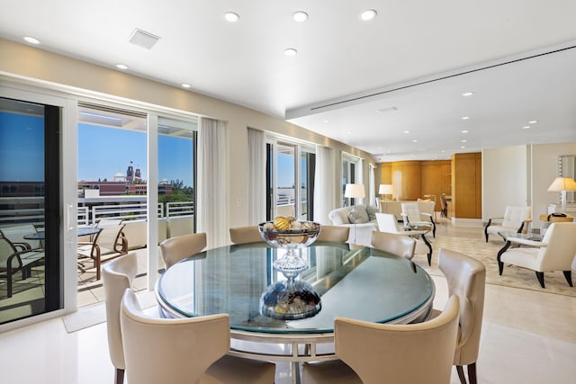 dining area featuring light tile patterned floors