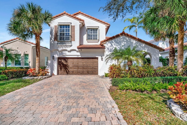 mediterranean / spanish-style house featuring a garage