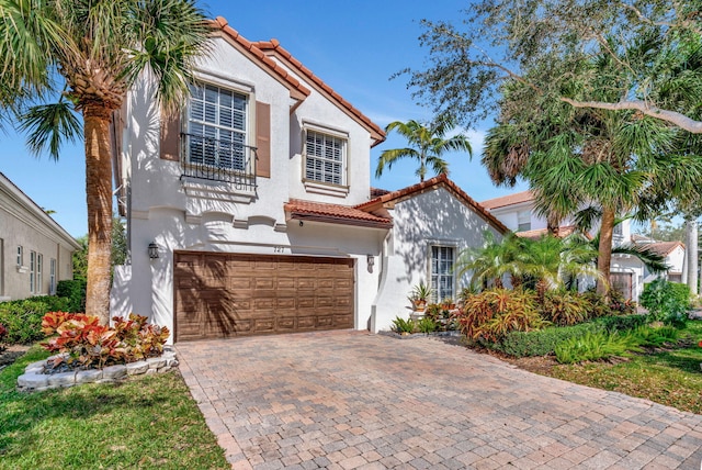 mediterranean / spanish-style home featuring a garage