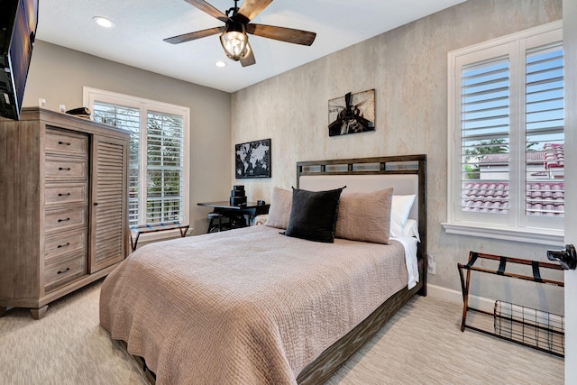 bedroom with light colored carpet and ceiling fan