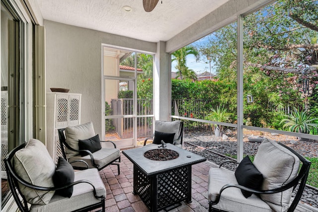 sunroom / solarium with ceiling fan