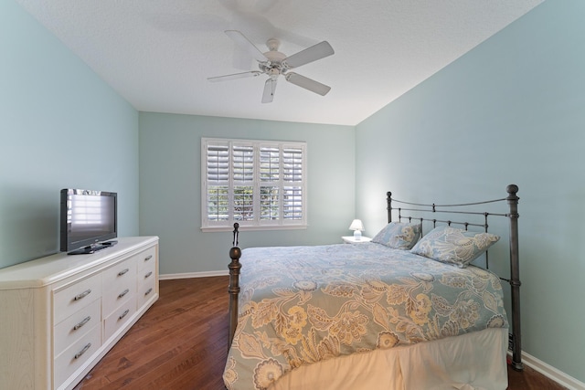 bedroom featuring a textured ceiling, ceiling fan, and dark hardwood / wood-style flooring