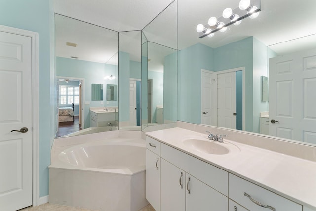 bathroom featuring a tub and vanity
