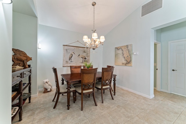dining area featuring a chandelier and lofted ceiling