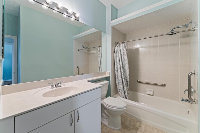 full bathroom featuring a textured ceiling, tile patterned flooring, vanity, toilet, and shower / bath combo with shower curtain