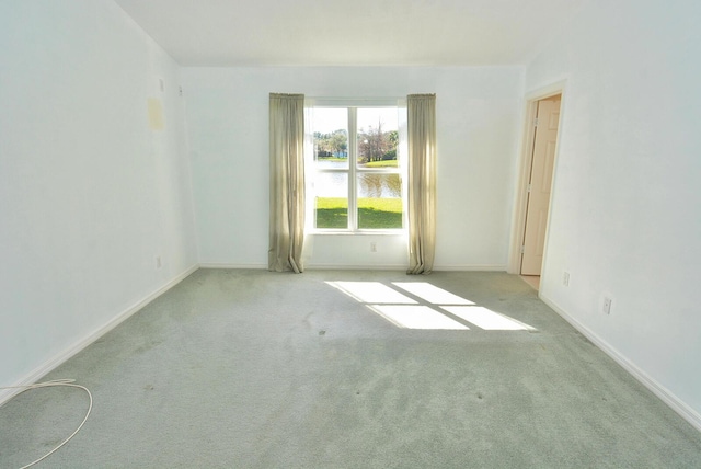 empty room featuring light colored carpet