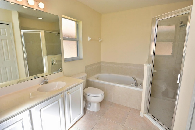 full bathroom with vanity, tile patterned floors, plus walk in shower, and toilet