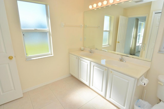 bathroom featuring tile patterned floors, toilet, and vanity