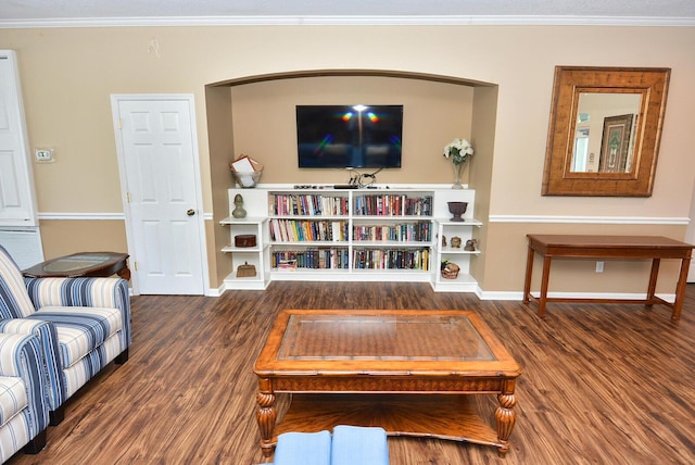 living room with crown molding and dark wood-type flooring