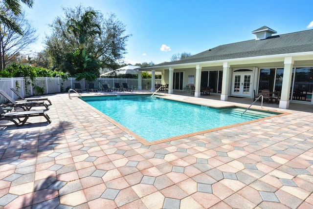 view of pool featuring a patio and french doors