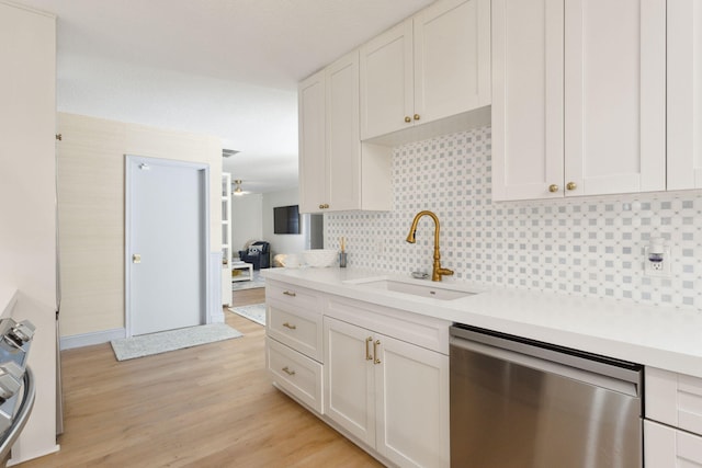 kitchen featuring sink, white cabinetry, and stainless steel dishwasher