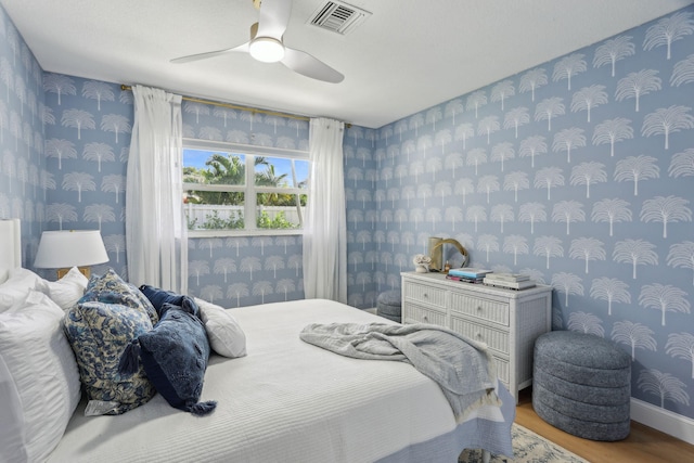 bedroom featuring ceiling fan and hardwood / wood-style floors