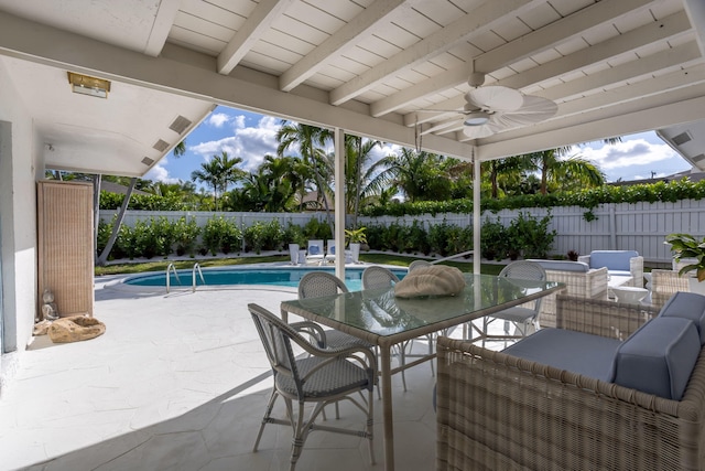 view of swimming pool featuring ceiling fan, a patio, and outdoor lounge area