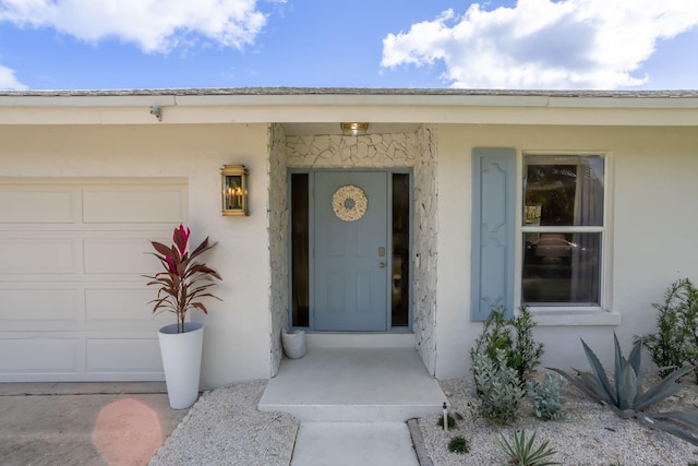 doorway to property featuring a garage