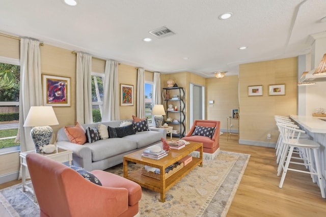 living room with light hardwood / wood-style floors