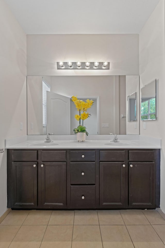 bathroom featuring tile patterned flooring and vanity