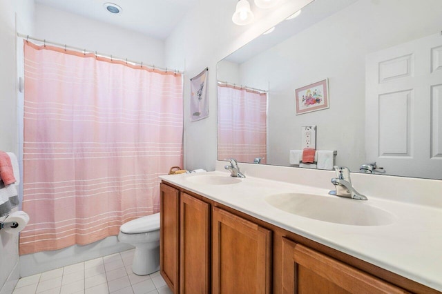 full bathroom with vanity, toilet, tile patterned flooring, and shower / bath combo